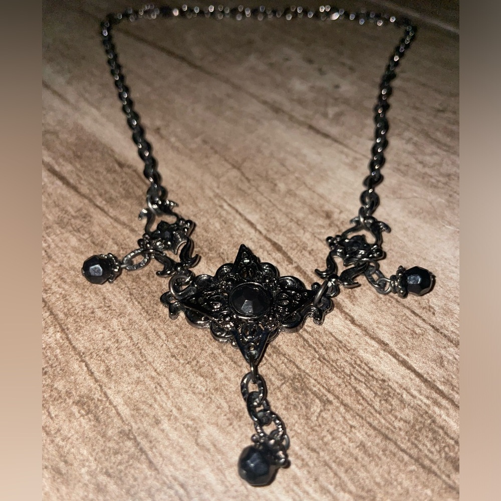 Black metal choker with dangling gems